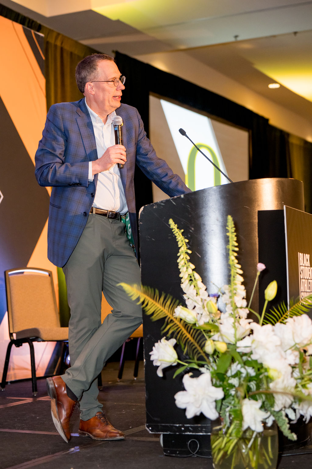 Speaker at the podium on the main summit stage