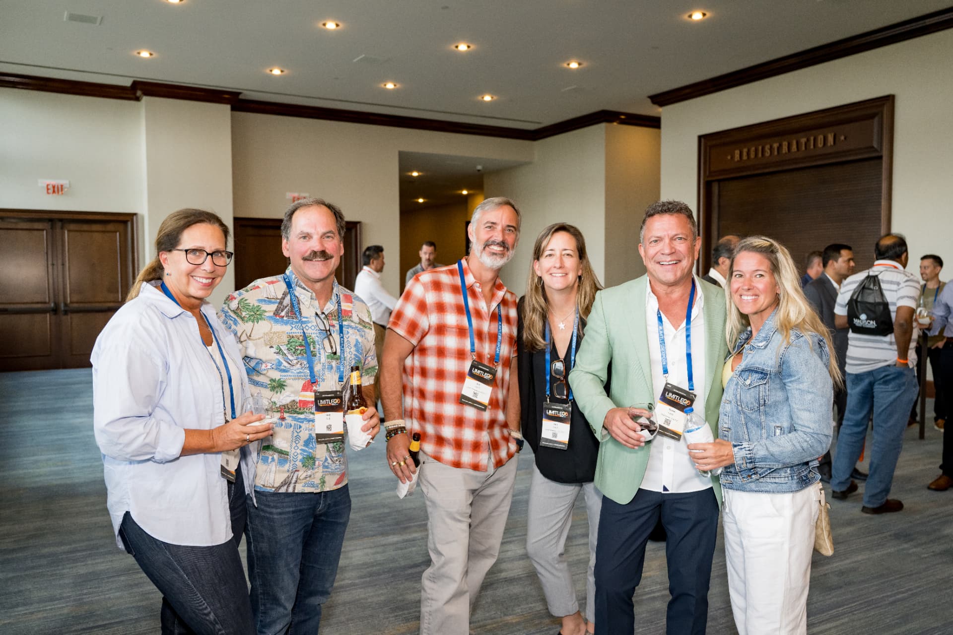 Group of guests posing together at a Limitless Expo networking reception