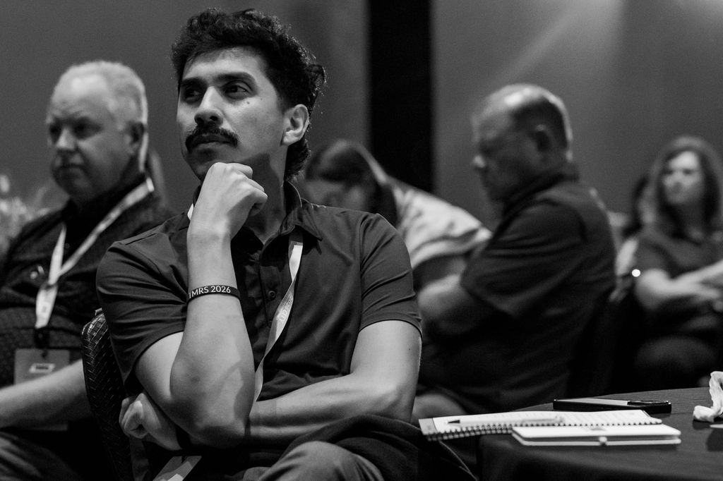 Attendee listening intently during a TMRS breakout session