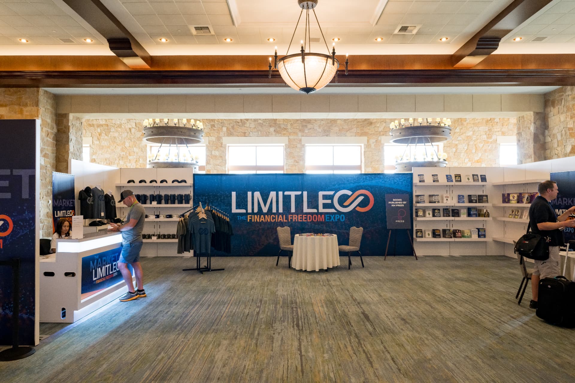 Limitless Financial Freedom Expo merchandise and book display in the hotel foyer