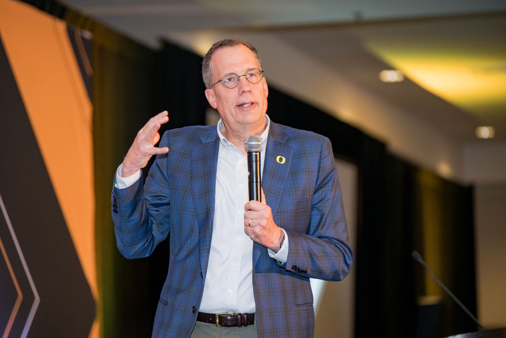 University of Oregon leader speaking to the summit audience