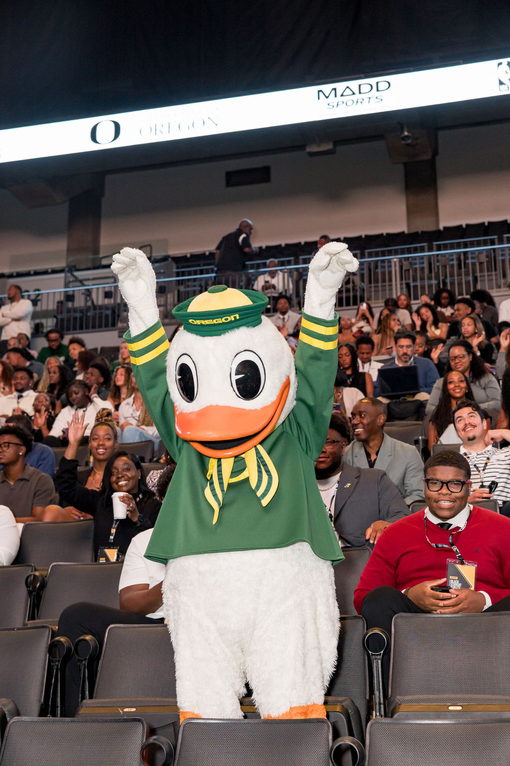 The Oregon Duck mascot celebrating with the crowd