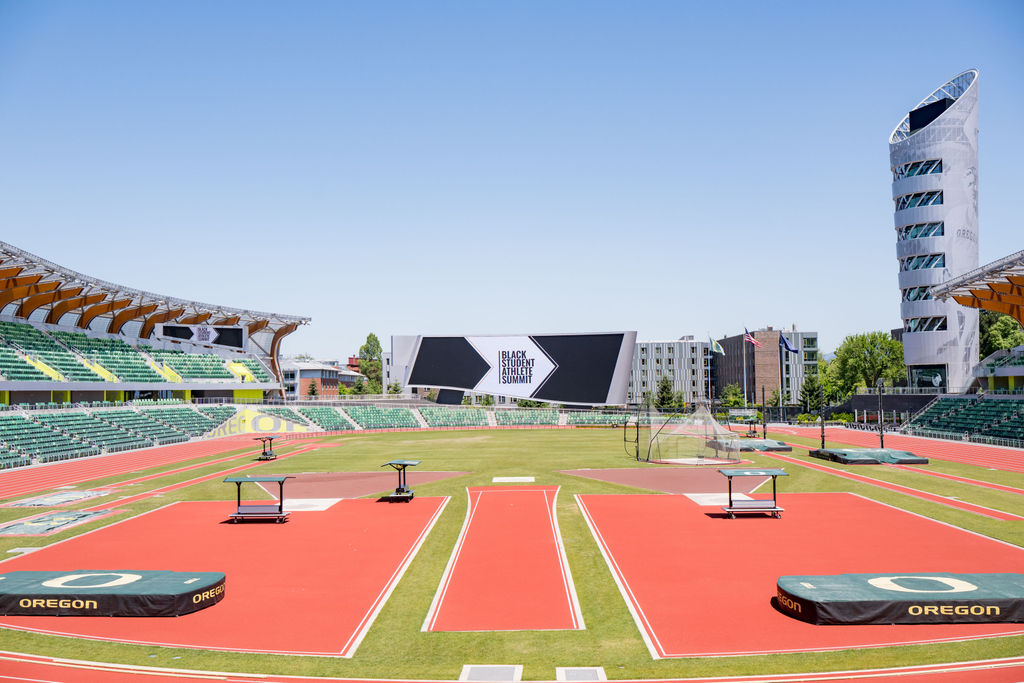 Wide view of Hayward Field with the summit branding on the video board