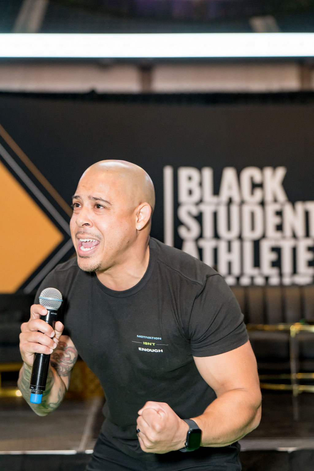 Speaker energizing the crowd on the Black Student Athlete Summit stage