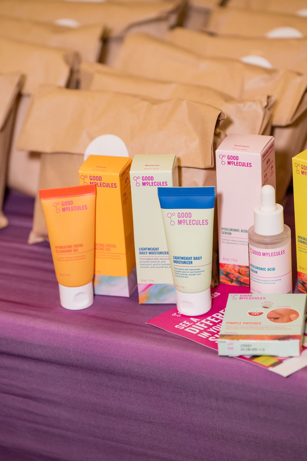 Good Molecules skincare products displayed with attendee gift bags