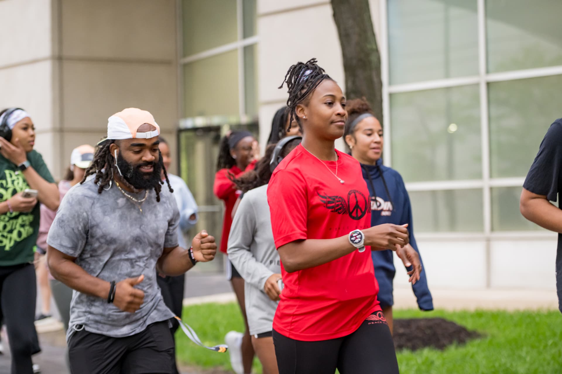 Two runners mid-stride during the morning group run