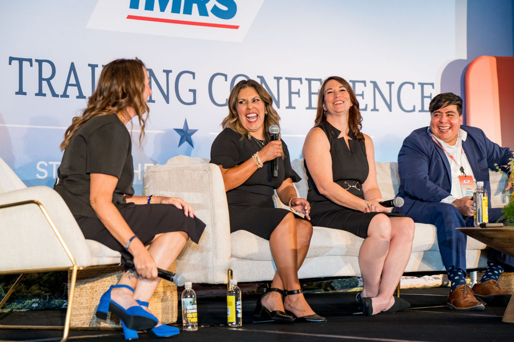 Panelists laughing together during a lively TMRS panel