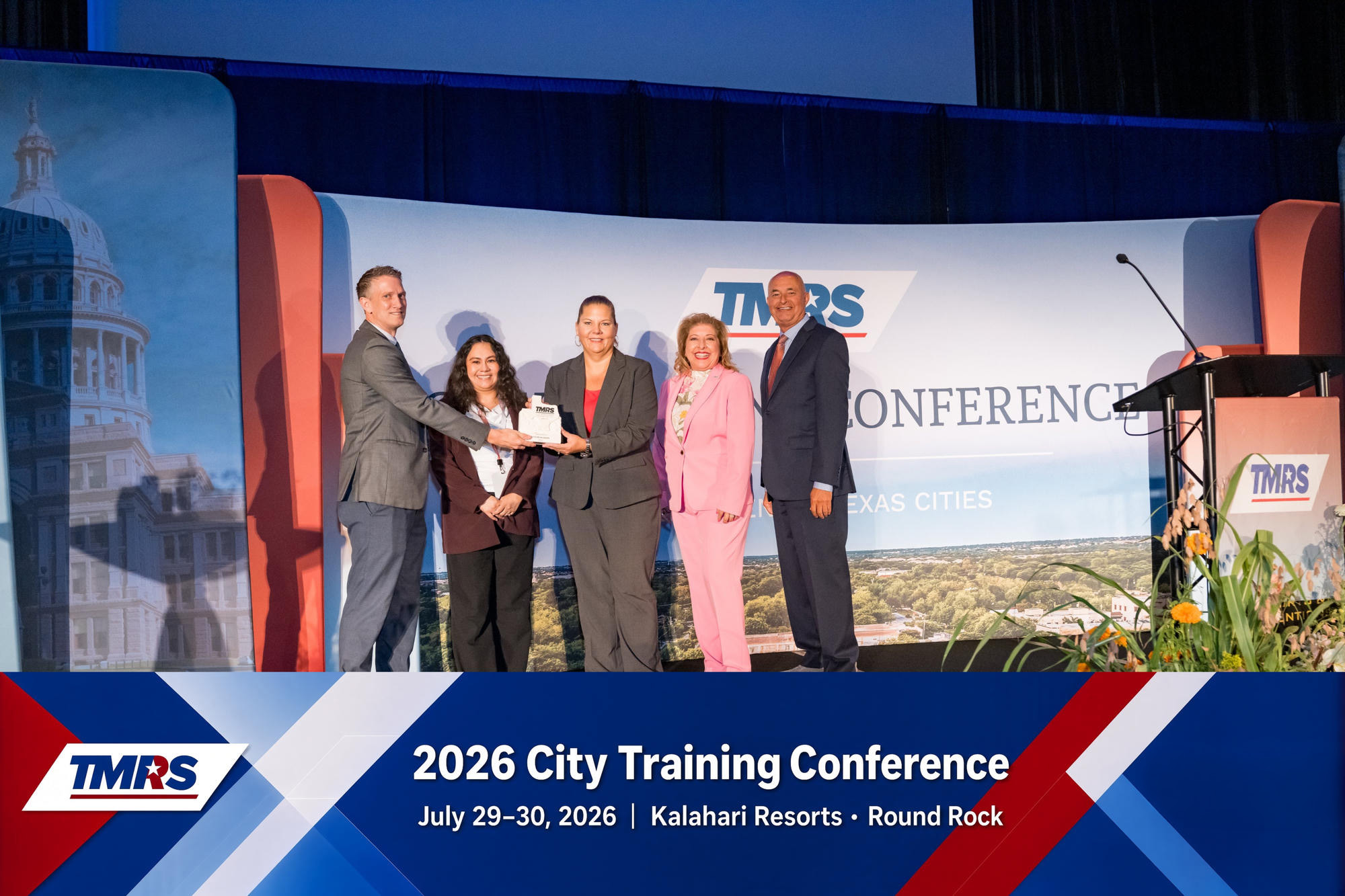 Branded TMRS 2026 City Training Conference photo of an award presentation on stage