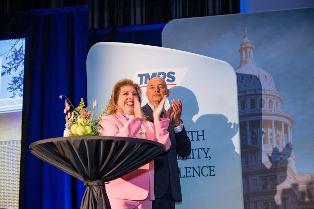 TMRS leadership applauding award recipients from the stage