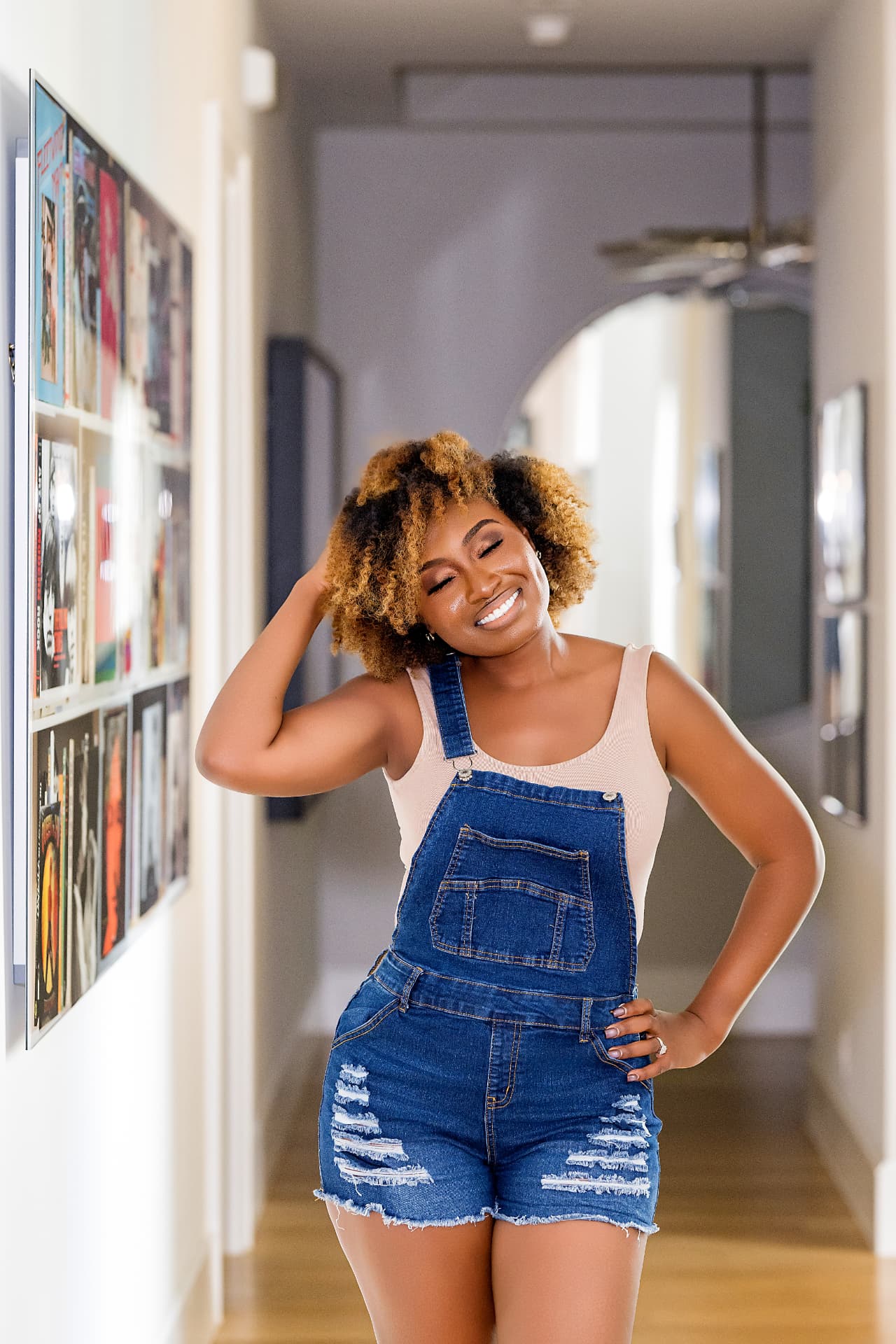Relaxed lifestyle brand portrait in a hallway gallery wall