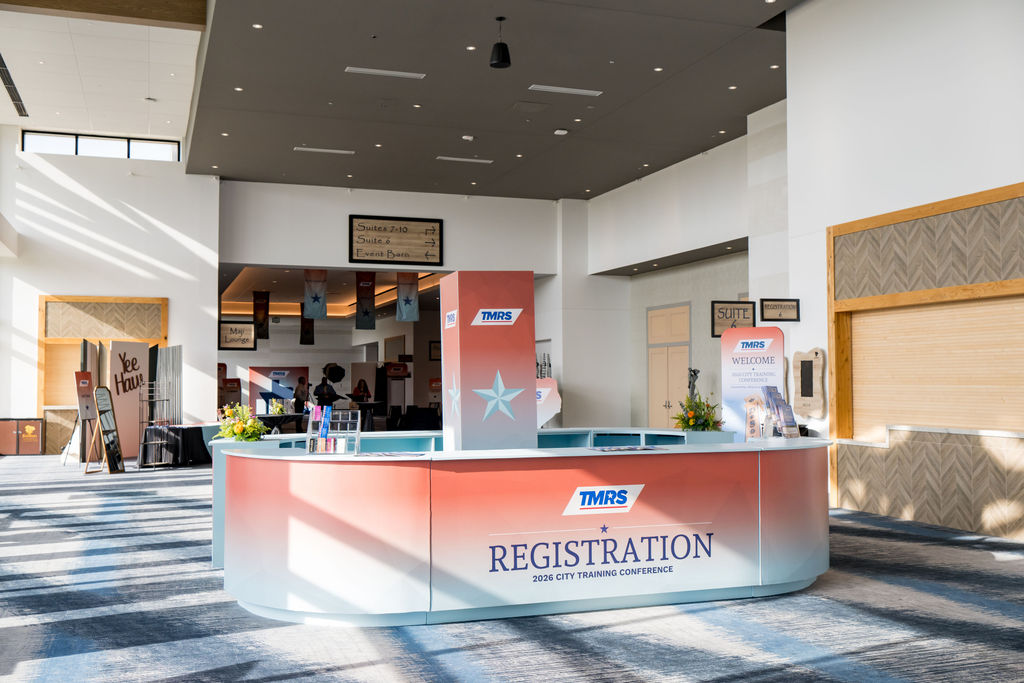 Sunlit TMRS registration desk in the conference lobby