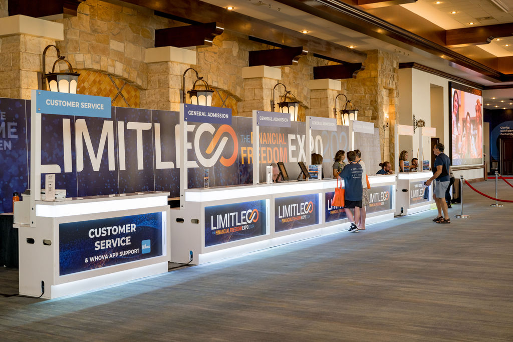 Limitless Financial Freedom Expo registration desks along the concourse