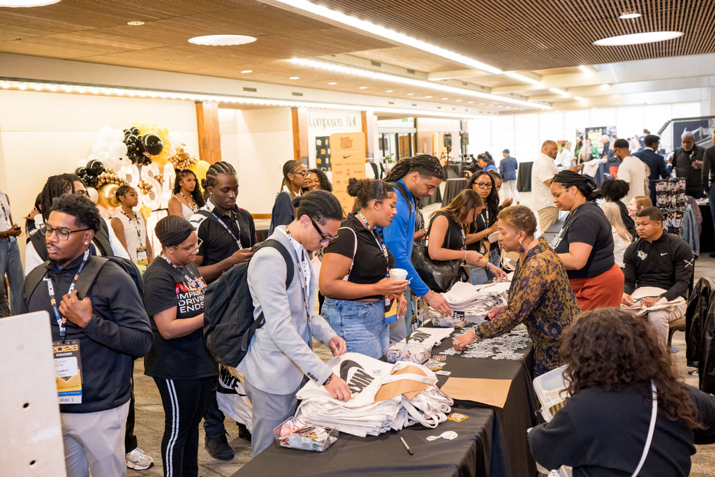 Busy registration and merchandise line at the BSA Summit