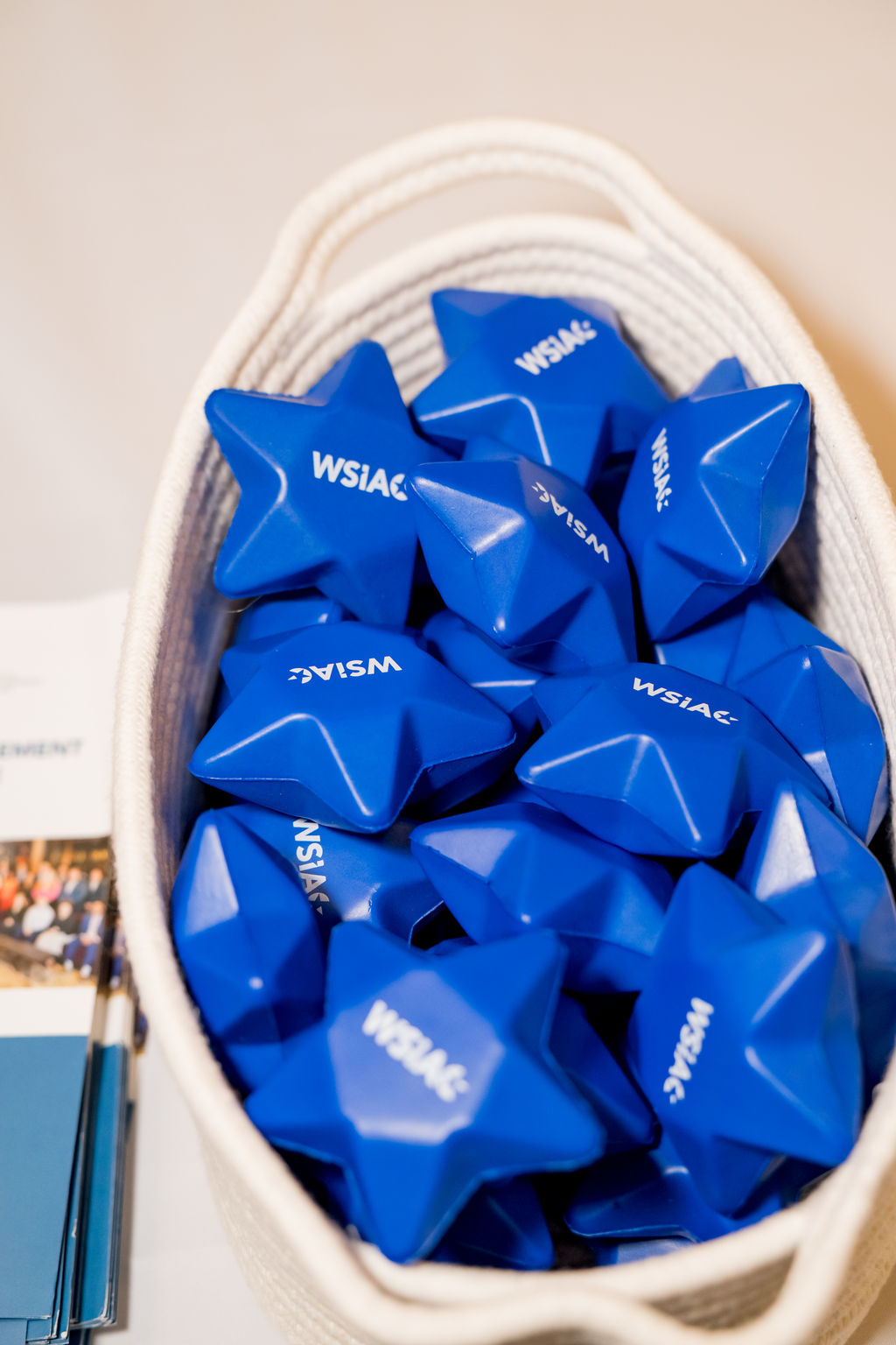 Branded WSIAC giveaway items in a basket at the BSA Summit