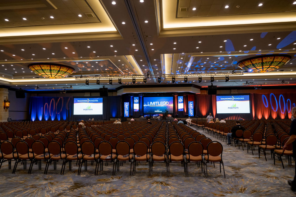 Empty ballroom set with rows of chairs before a Limitless Expo keynote