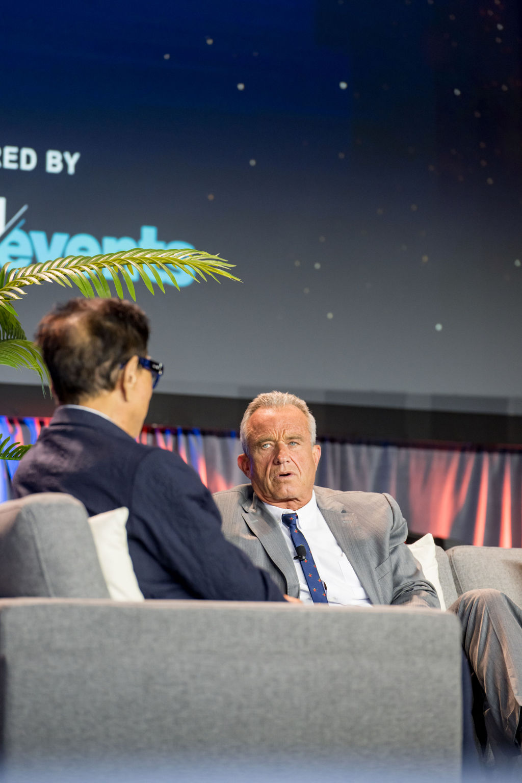 Two speakers in conversation during a Limitless Expo main stage interview