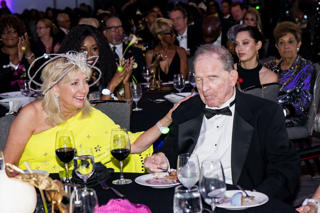Guests sharing a moment at their table during dinner