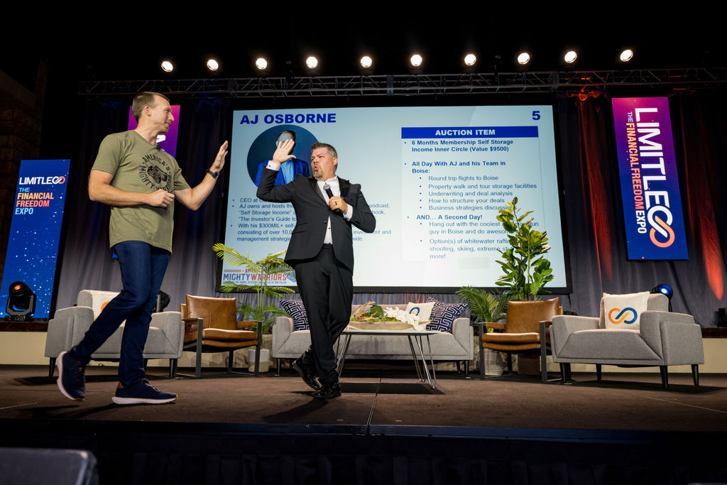 Two presenters interacting on stage at Limitless Expo