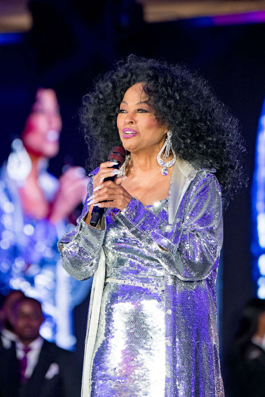 Close portrait of the headline performer singing