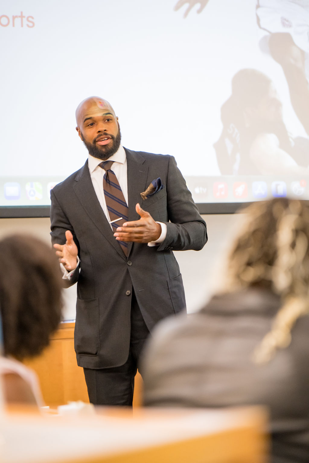 Keynote speaker addressing the room during a summit session