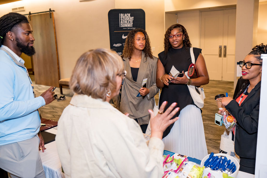 Student athletes in conversation with sponsors at the BSA Summit