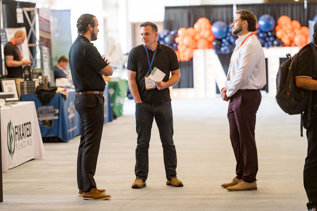 Attendees networking in the Limitless Expo exhibitor hall