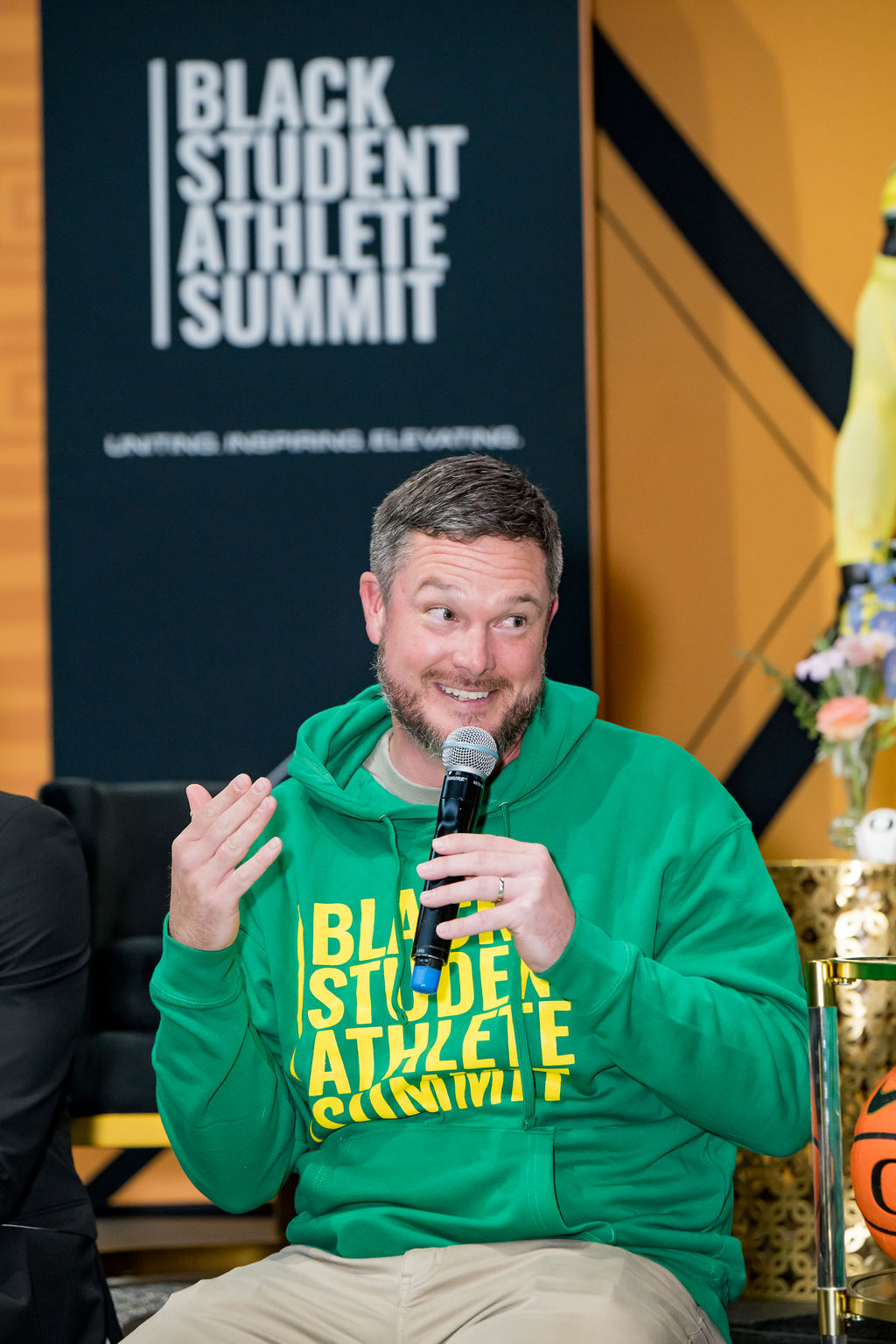 Speaker in summit apparel during a panel discussion