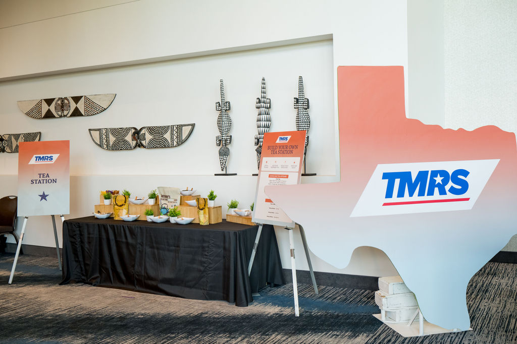 TMRS tea station with Texas-shaped signage at the conference