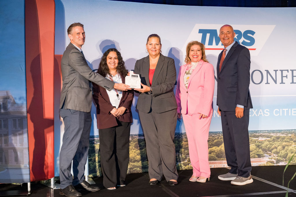 City team accepting a TMRS recognition award on stage