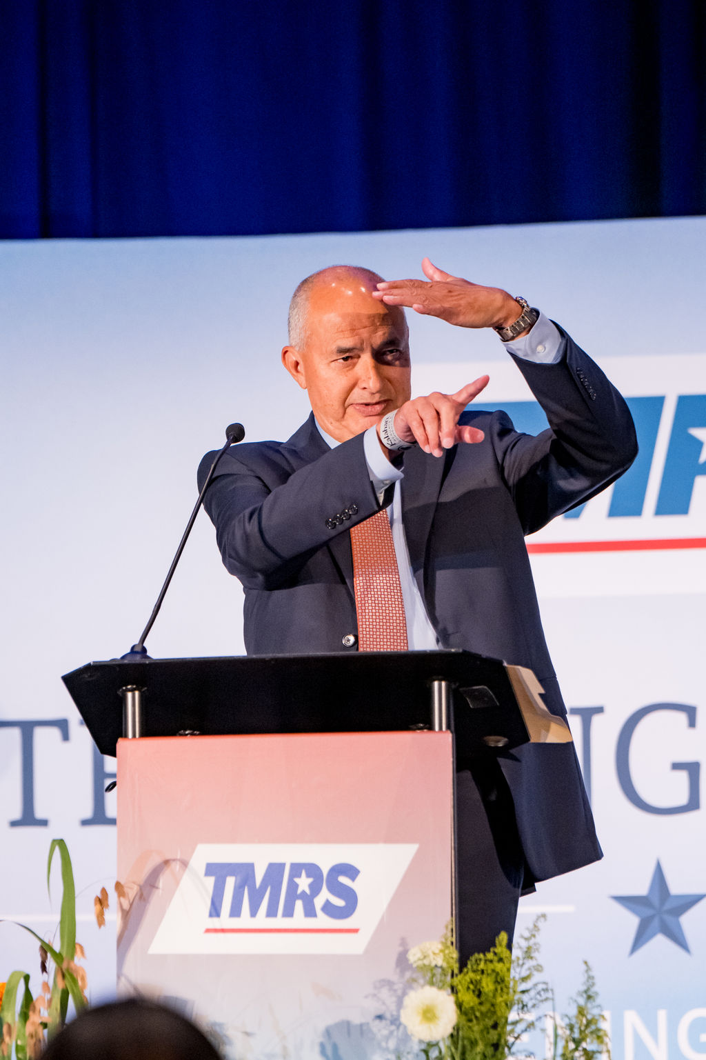 Presenter gesturing during a TMRS general session talk