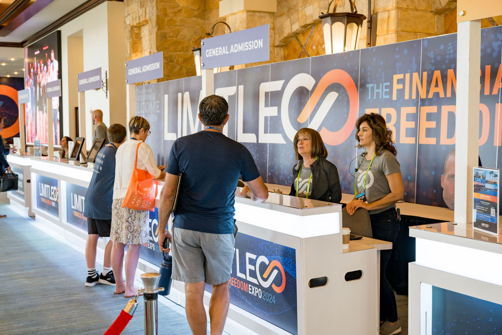 Guests checking in with staff at Limitless Expo general admission