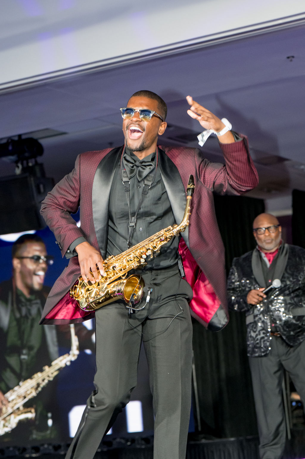 Saxophonist mid-performance with the band