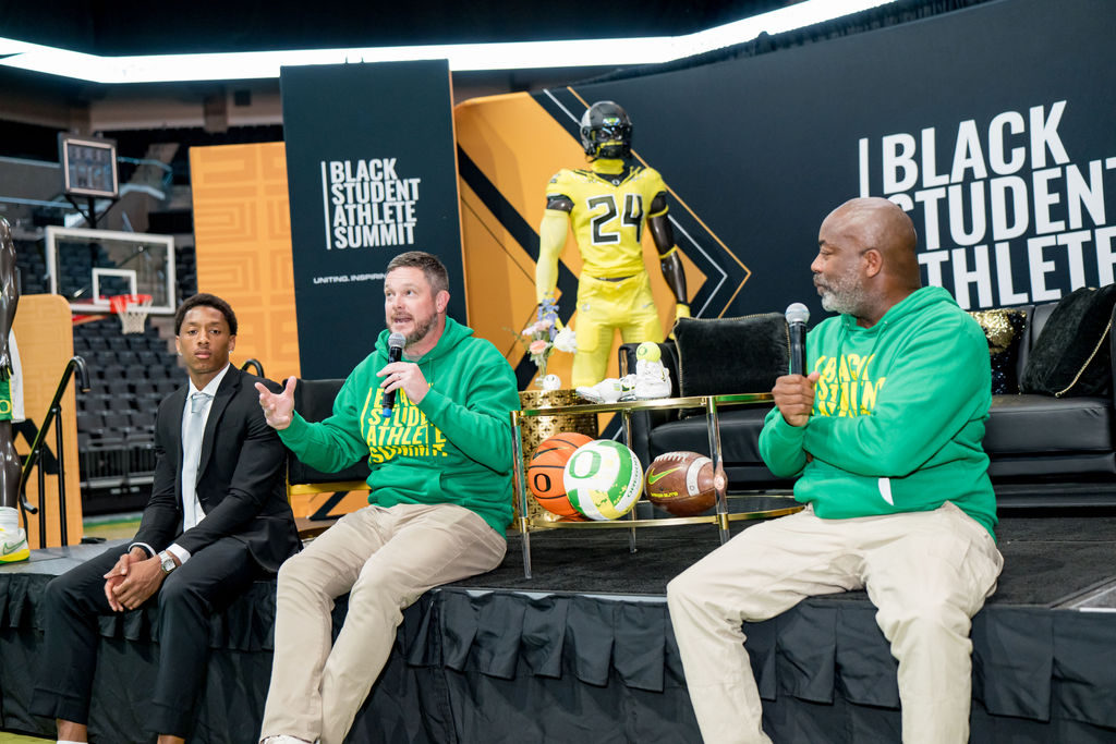 Full panel on stage in front of the summit backdrop