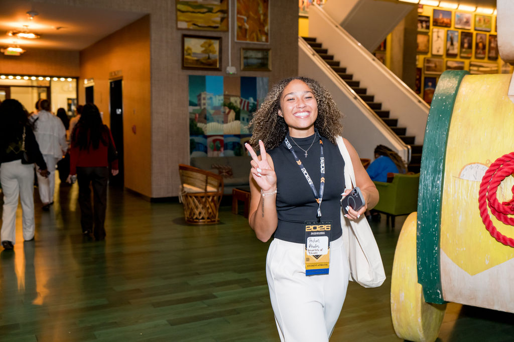 Student athlete smiling in the hotel lobby at the BSA Summit