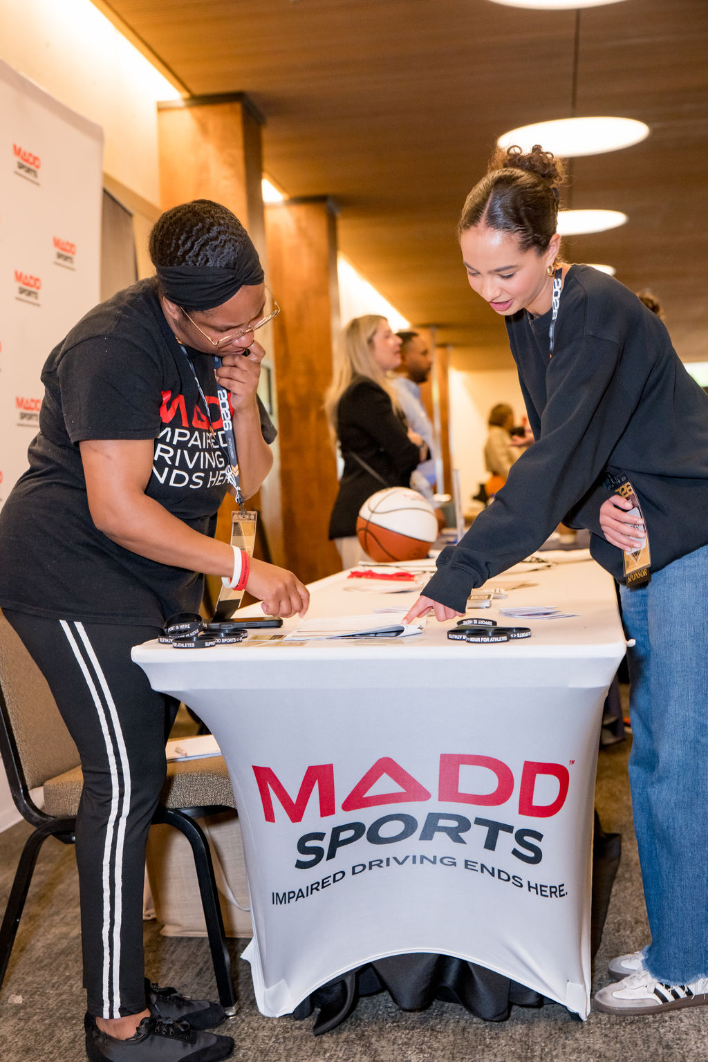 MADD Sports sponsor table with attendees at the BSA Summit