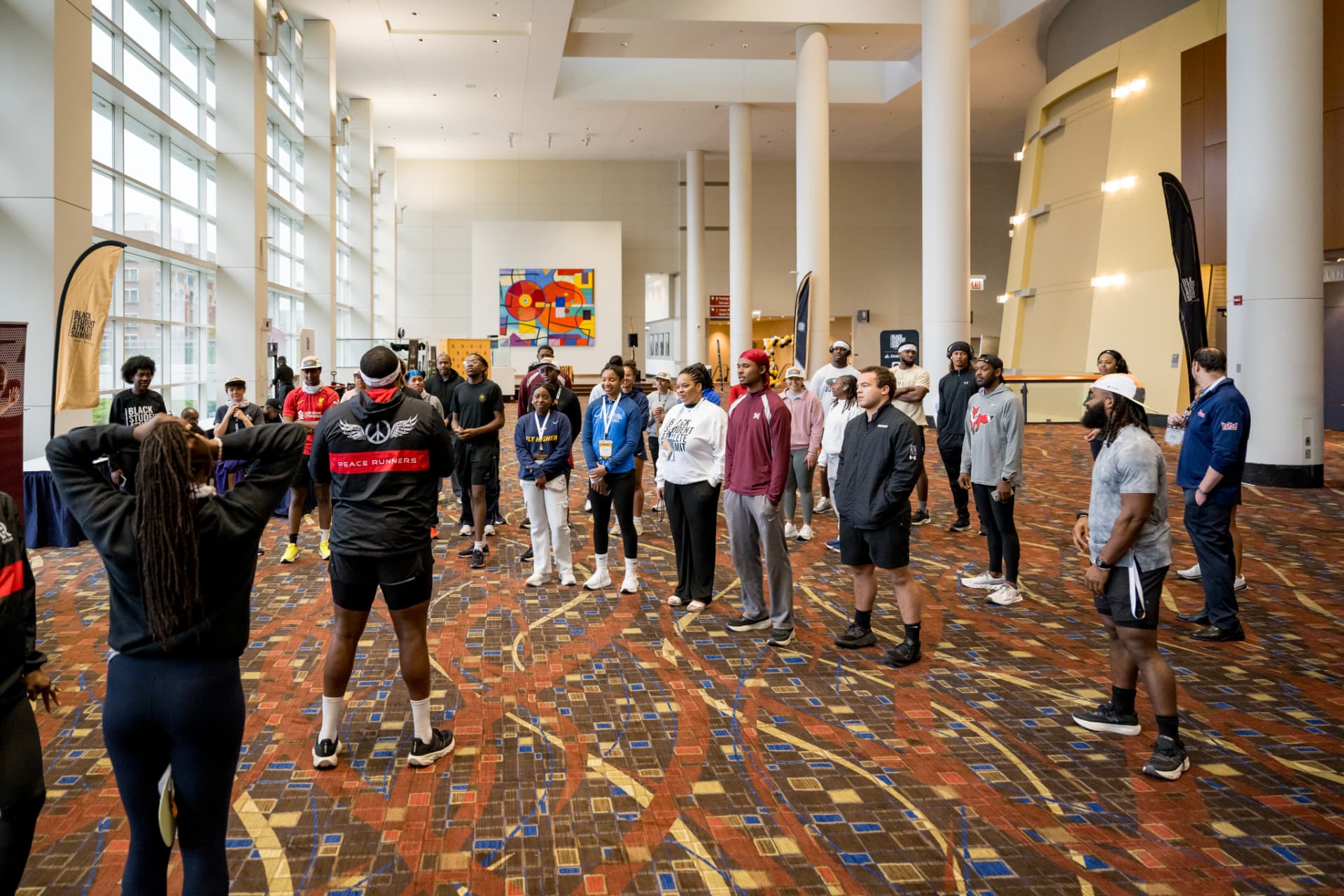 Group gathered in a convention center hall before a morning workout
