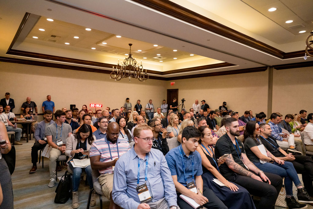 Full breakout room of attendees taking notes at Limitless Expo
